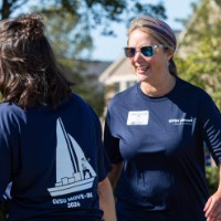 GVSU Alumna smiles at someone walking by